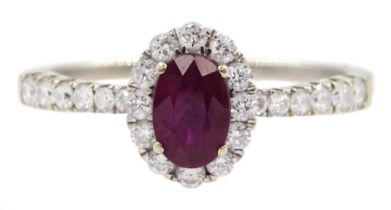 18ct white gold oval ruby and round brilliant cut diamond cluster ring