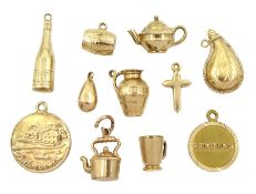 Seven 9ct gold pendant / charms including kettle