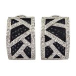 Pair of white and black gold round brilliant cut black and white diamond