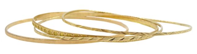 Two 18ct gold bangles and two 9ct gold bangles