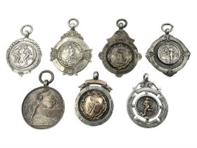 Seven early 20th century silver fobs