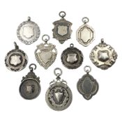 Ten early 20th century silver cartouche fobs