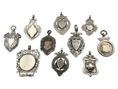 Ten early 20th century silver cartouche fobs