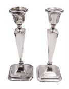 Pair of early 20th century silver mounted candlesticks