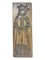 Wooden gingerbread mould modelled as a woman in traditional dress