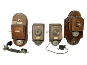 Two Hunningscone patent wall mounting telephones in walnut casing