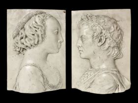 Pair of composite wall plaques of a male and female in Roman period dress