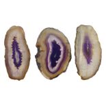 Three purple agate slices