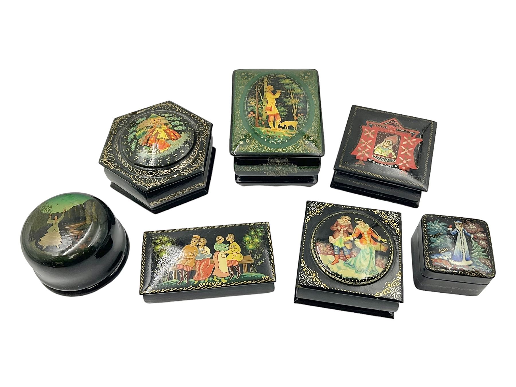 Seven 20th century Russian black lacquered papier Mache boxes