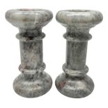 Pair of grey marble column candlesticks