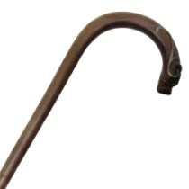 19th century carved wooden walking stick the curved handled modelled as a dog with silver mounts and