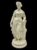 Parian figure modelled as a female in classical dress leaning upon a tree stump