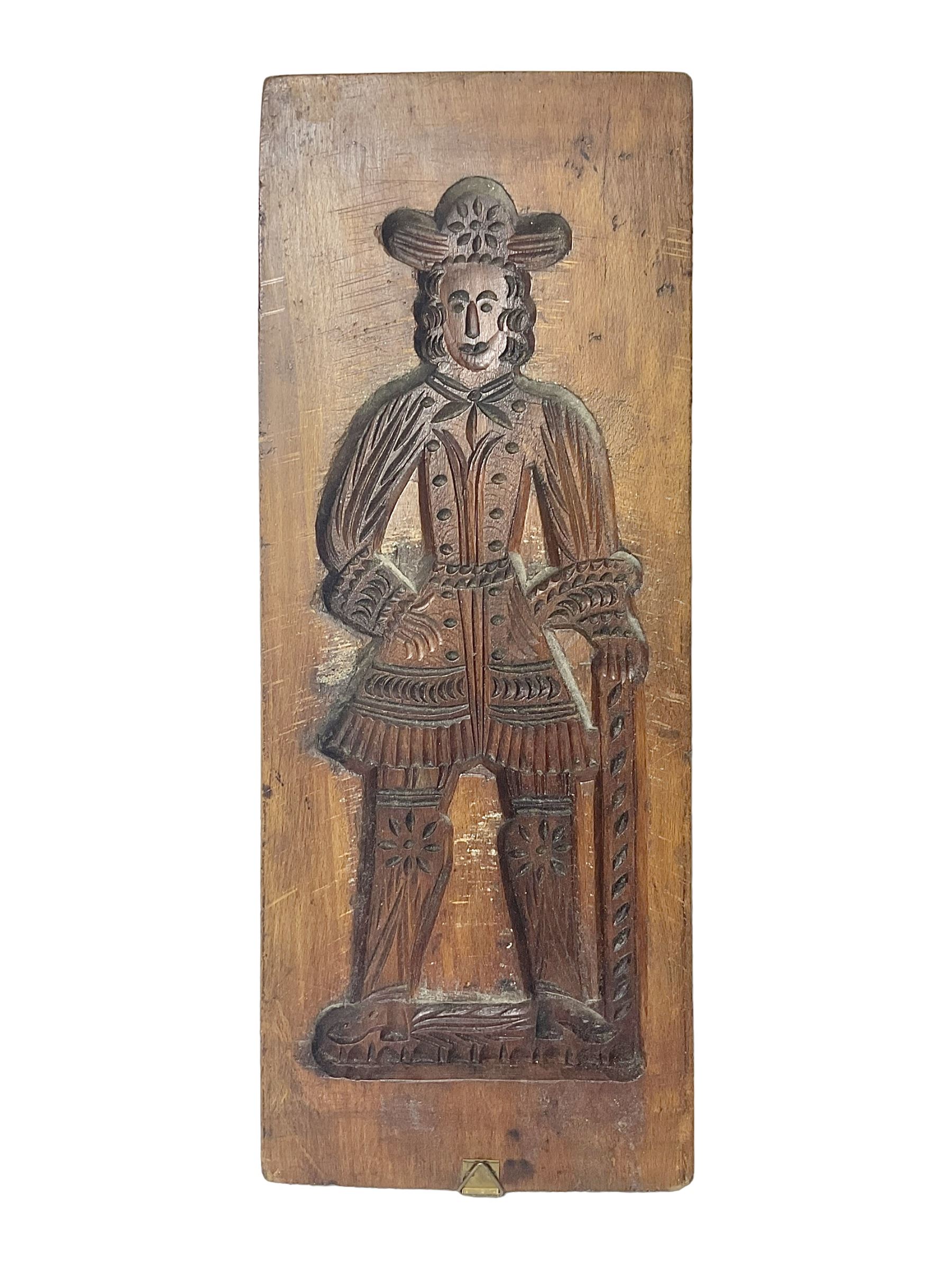 Wooden two sided gingerbread mould modelled as a man and a woman in traditional dress