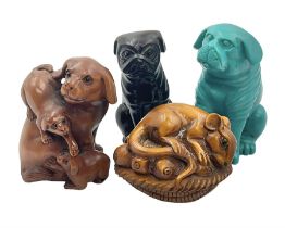 Four carved wood and composite netsuke