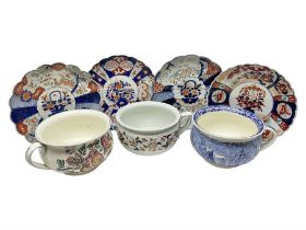 Four Japanese imari chargers together with three chamber pots