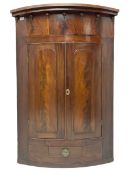 Victorian mahogany bow-front corner cupboard