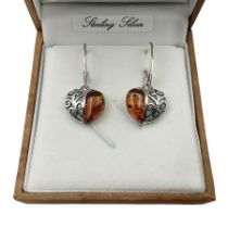 Pair of silver Baltic amber heart pendant earrings