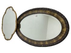 Shaped gilt framed wall mirror decorated with shell motifs (61cm x 45cm); and an oval framed wall mi