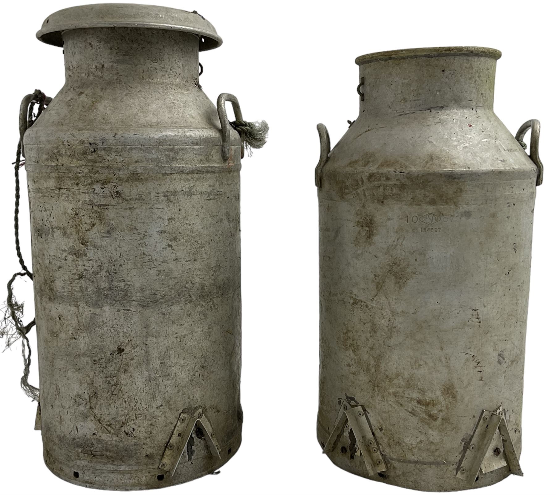 Near pair of antique aluminium milk churns with twin handles