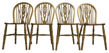 Set of four elm and beech wheelback dining chairs
