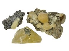 Three calcite crystal specimens