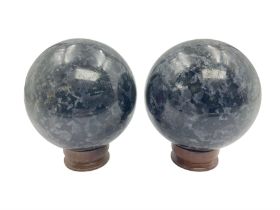 Pair of indigo gabbro spheres