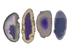 Four purple agate slices of various sizes