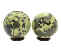 Pair of green serpentine spheres