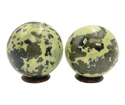 Pair of green serpentine spheres