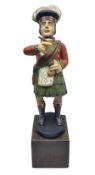 20th century painted tobacco advertisement in the form of a Scotsman wearing kilt with a cigar