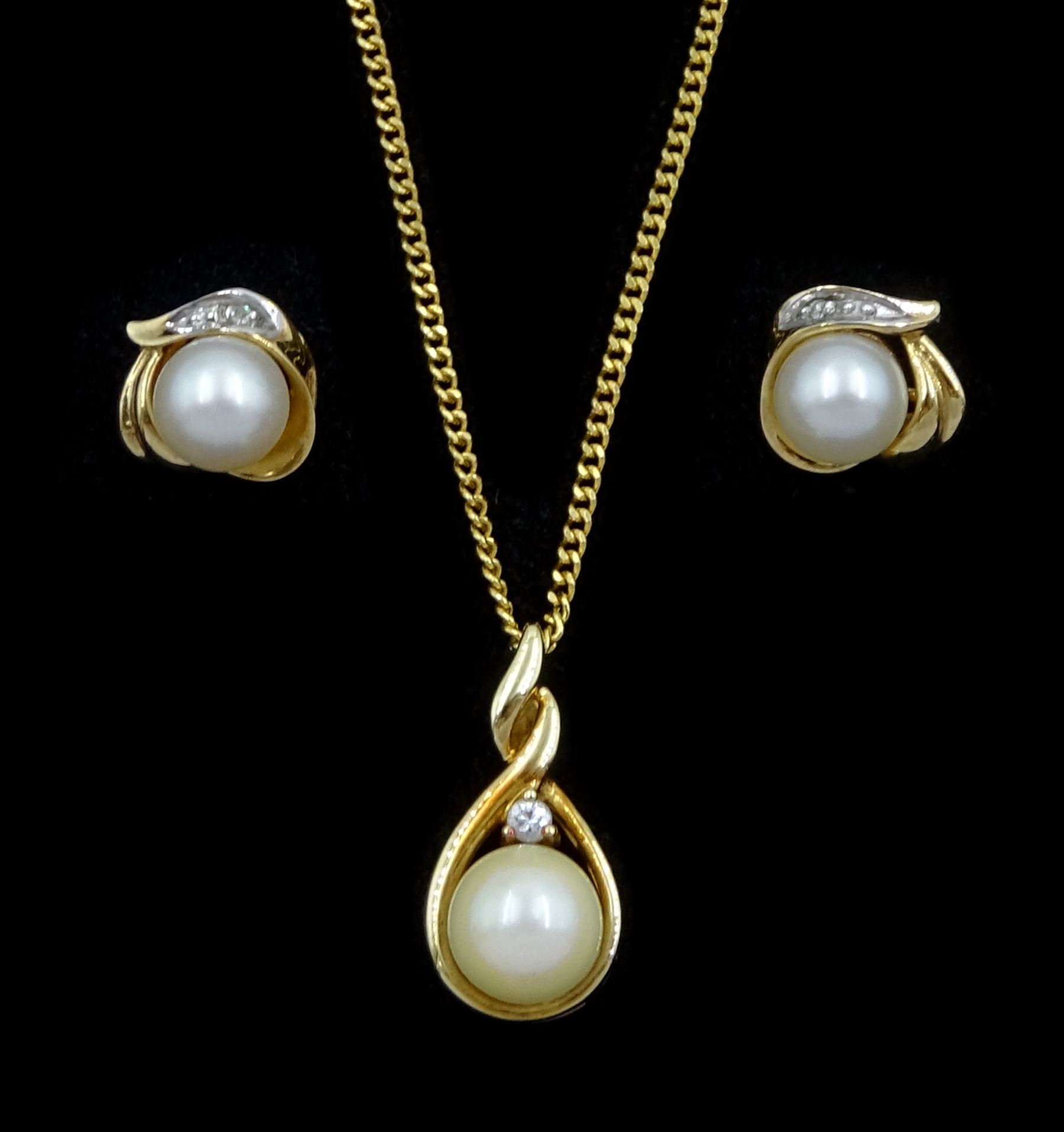 Gold cultured pearl and round brilliant cut diamond pendant necklace and a similar pair of pearl and