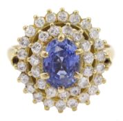 14ct gold oval sapphire and two row round brilliant cut diamond cluster ring