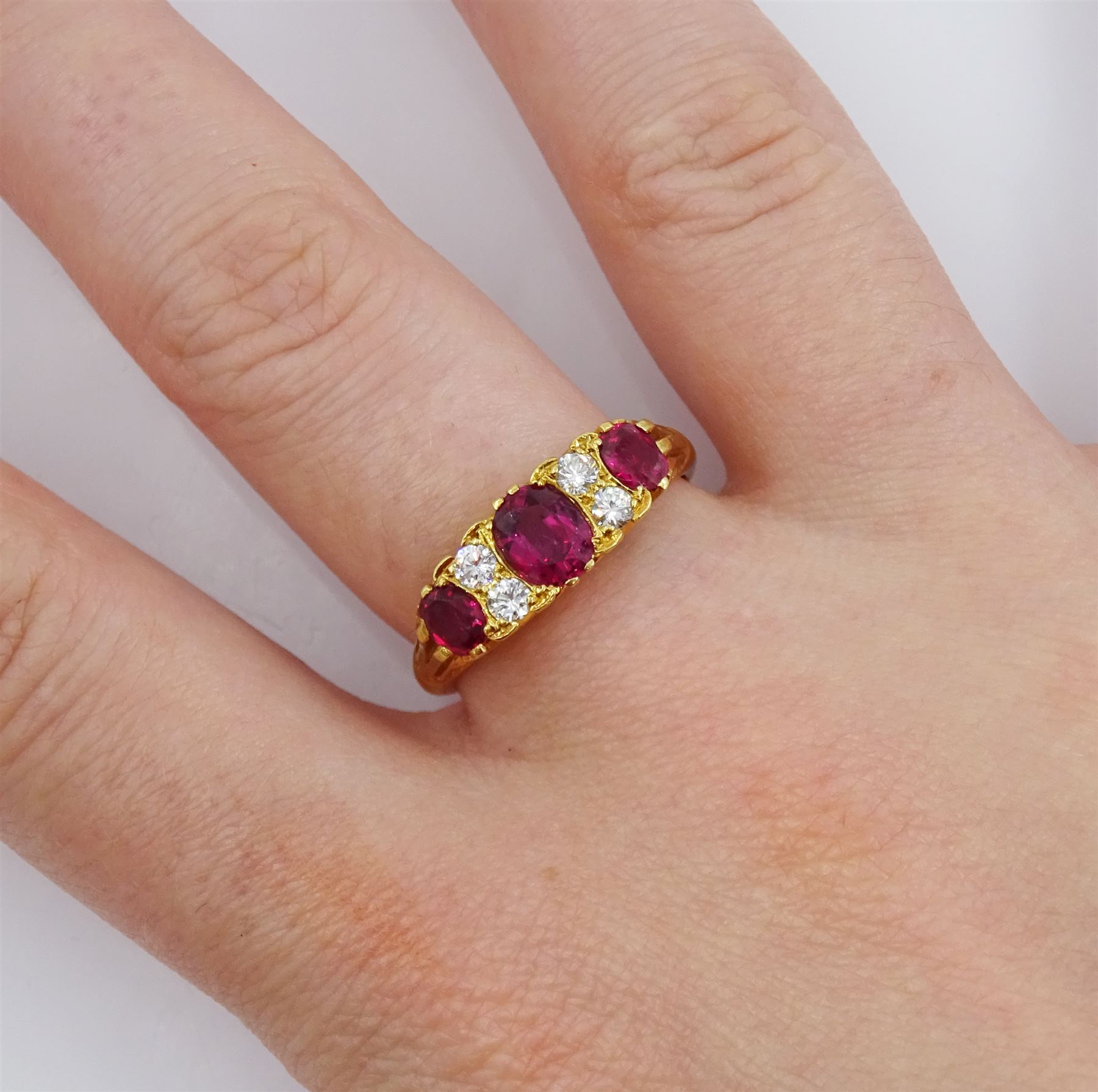 18ct gold three stone oval cut ruby and four stone round brilliant cut diamond ring - Image 2 of 4