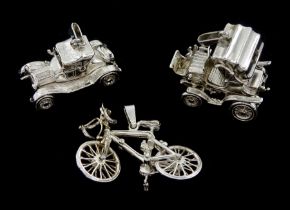 Three silver pendant / charms including rickshaw