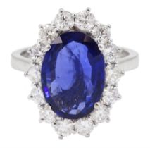 18ct white gold oval sapphire and round brilliant cut diamond cluster ring