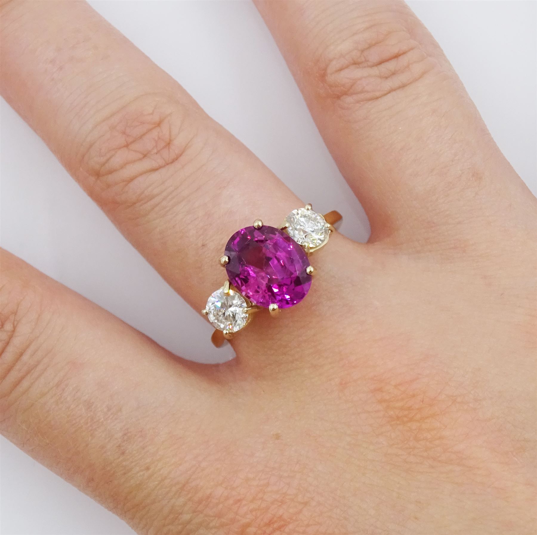 18ct gold three stone oval cut pink sapphire and round brilliant cut diamond ring - Image 2 of 4