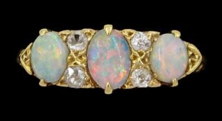 Early 20th century three stone opal and four stone old cut diamond ring