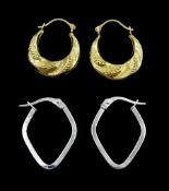 Pair of white gold hoop earrings and a pair of yellow gold hoop earrings
