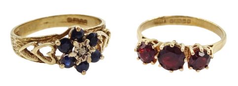 Gold three stone garnet ring and a gold sapphire and diamond cluster ring