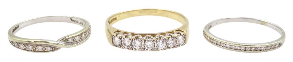 Two white gold diamond half eternity rings and a yellow gold seven stone cubic zirconia ring