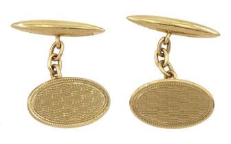Pair of early 20th century 9ct gold cufflinks with engine turned decoration