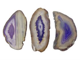 Three purple agate slices