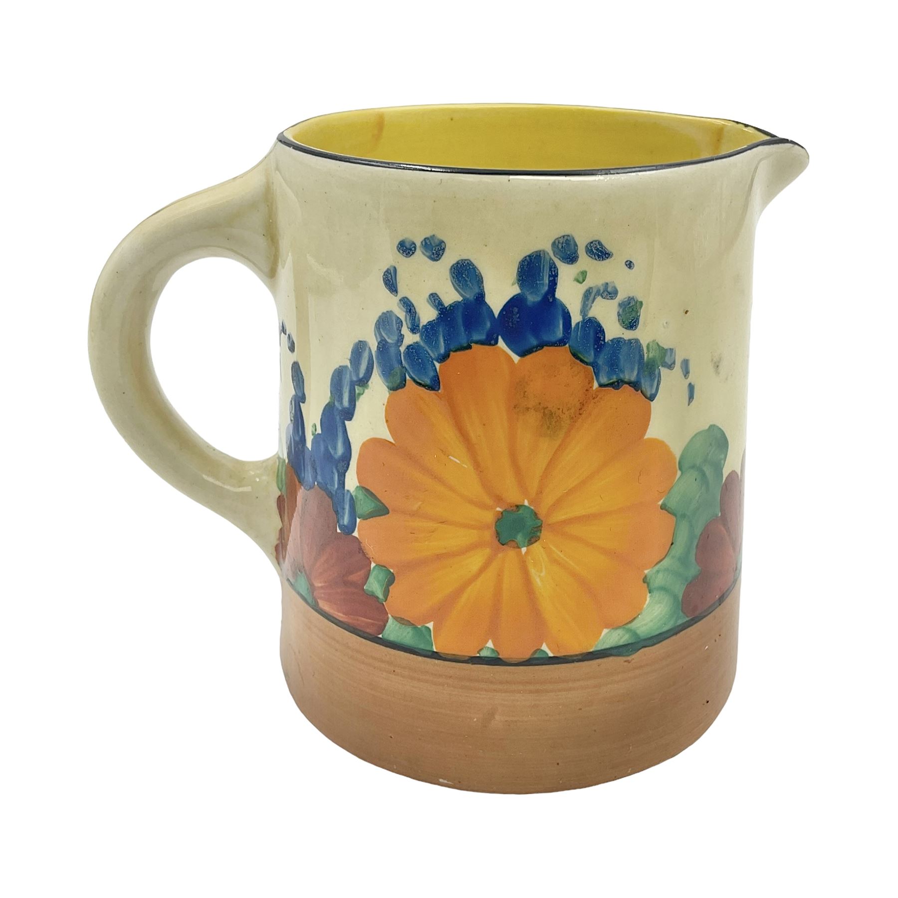 Clarice Cliff Bizarre milk jug decorated in the 'Gayday' Pattern