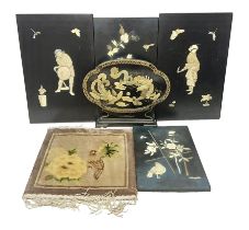 Set of four Chinese lacquered wall plaques