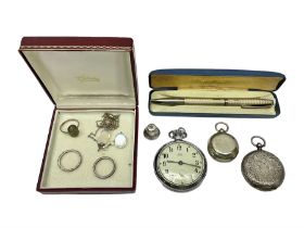 Silver fob watch and three silver rings
