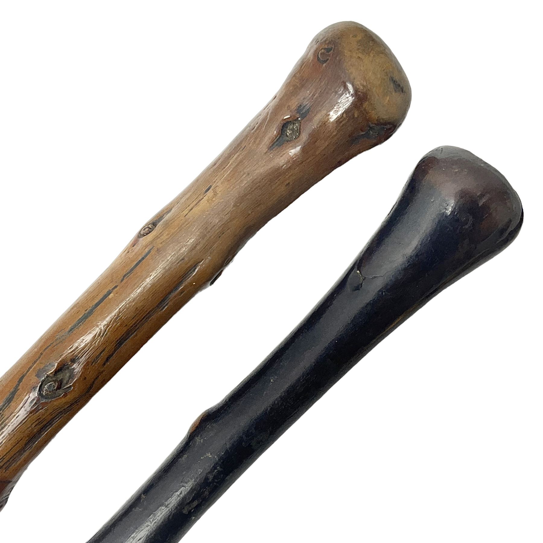 Two wooden walking sticks