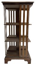 Edwardian inlaid walnut revolving three-tier bookcase