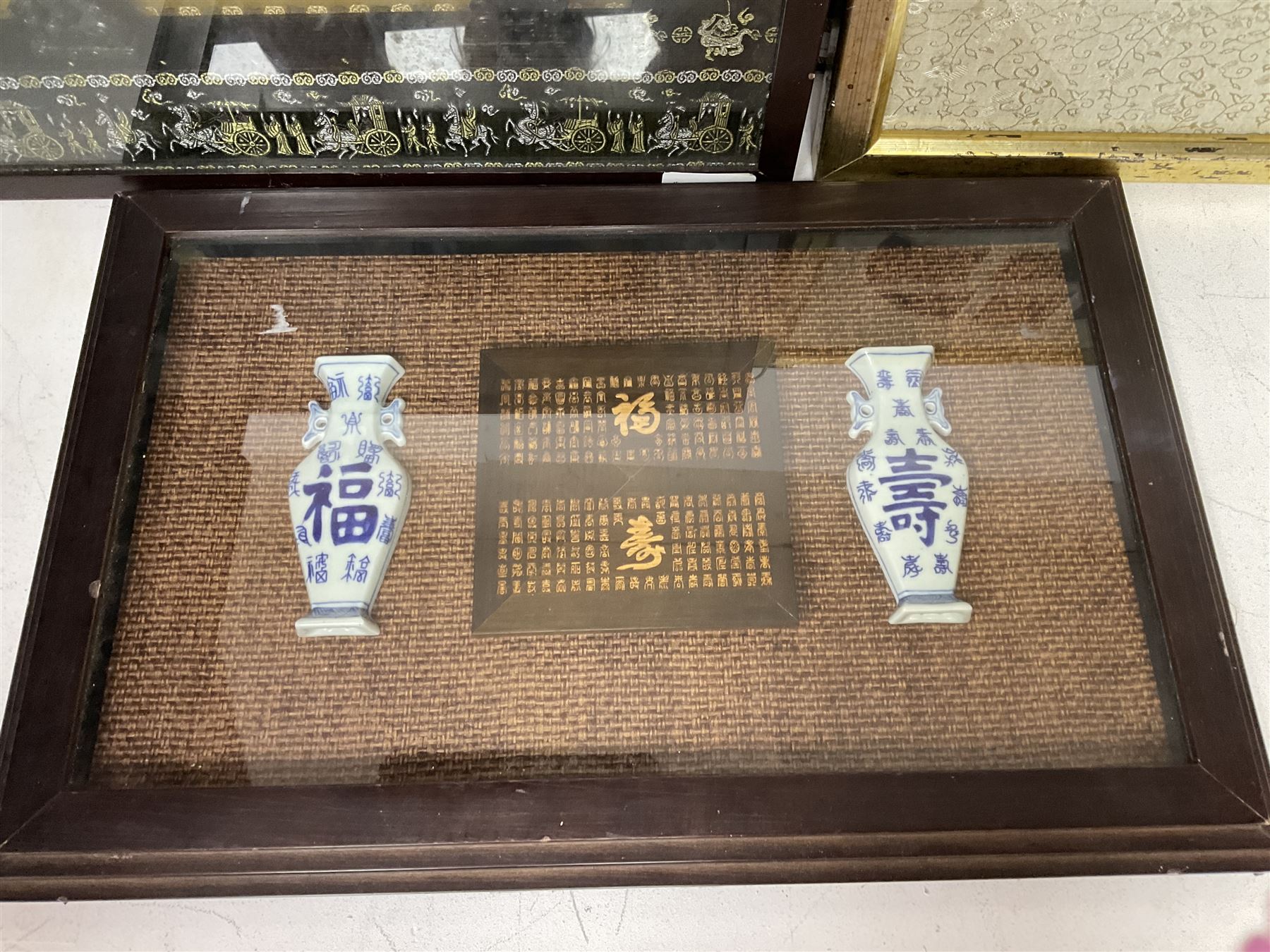 Four framed displays of Oriental decorative items - Image 4 of 5