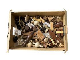 Box of assorted wooden turned finals and various wooden clock case ornaments.