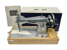 Seamstress sewing machine in case